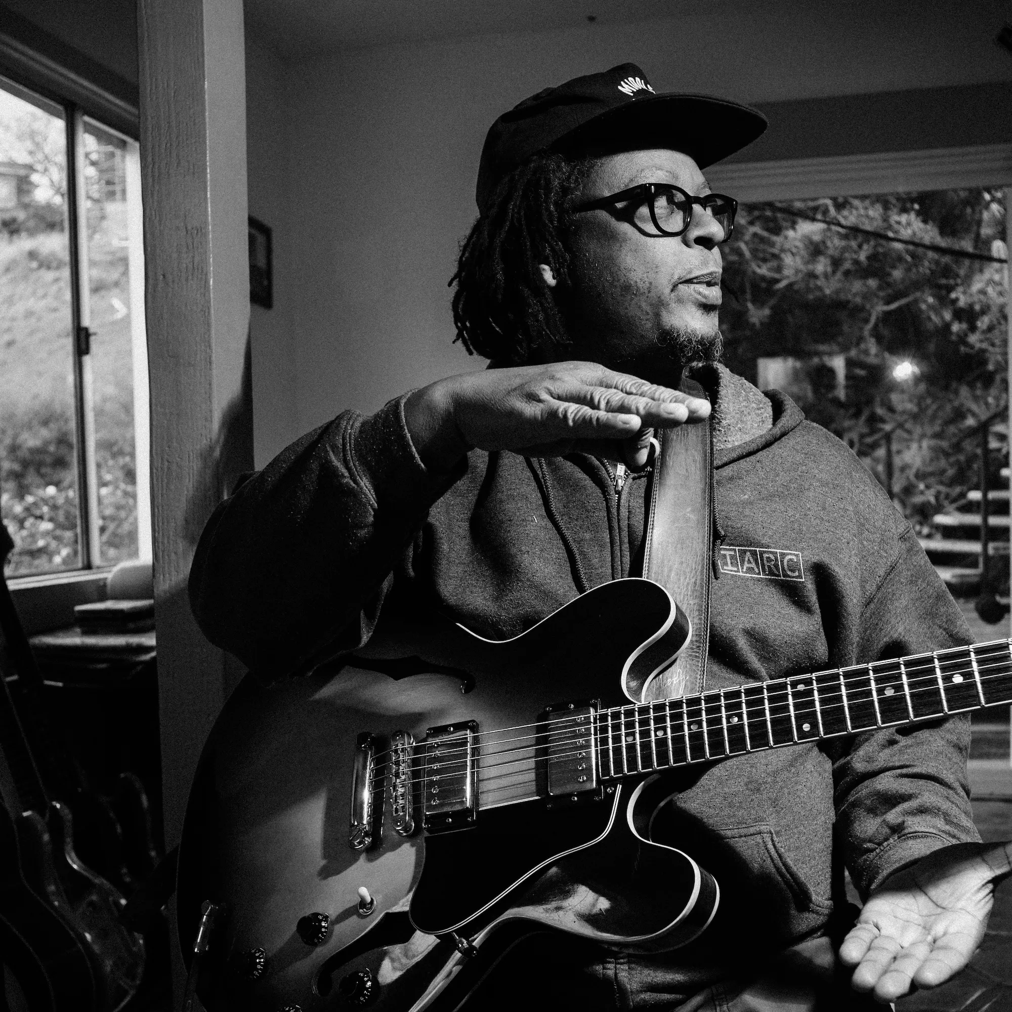 Musician Jeff Parker in the studio with his guitar.
